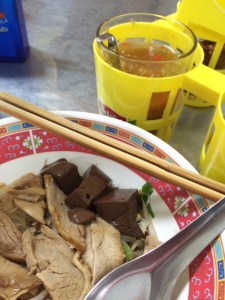 Duck noodles with the condiment tray at Guaythiew Ped on St. Louis Road